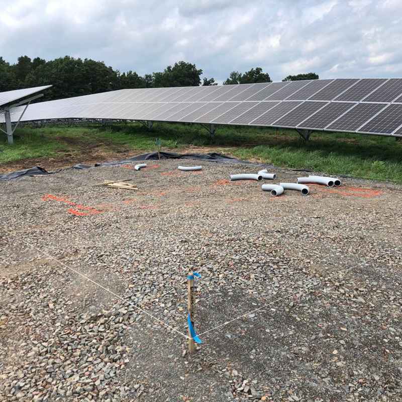 Solar Array Construction on Gravel at a Landfill, Featuring Recycled Train Parts in Springfield, MA