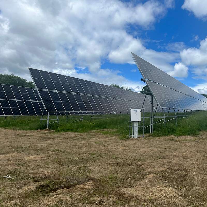 Solar Farm with Rows of Ground-Mounted PV Panels Installed Across a Grassy Site in New Sharon, ME